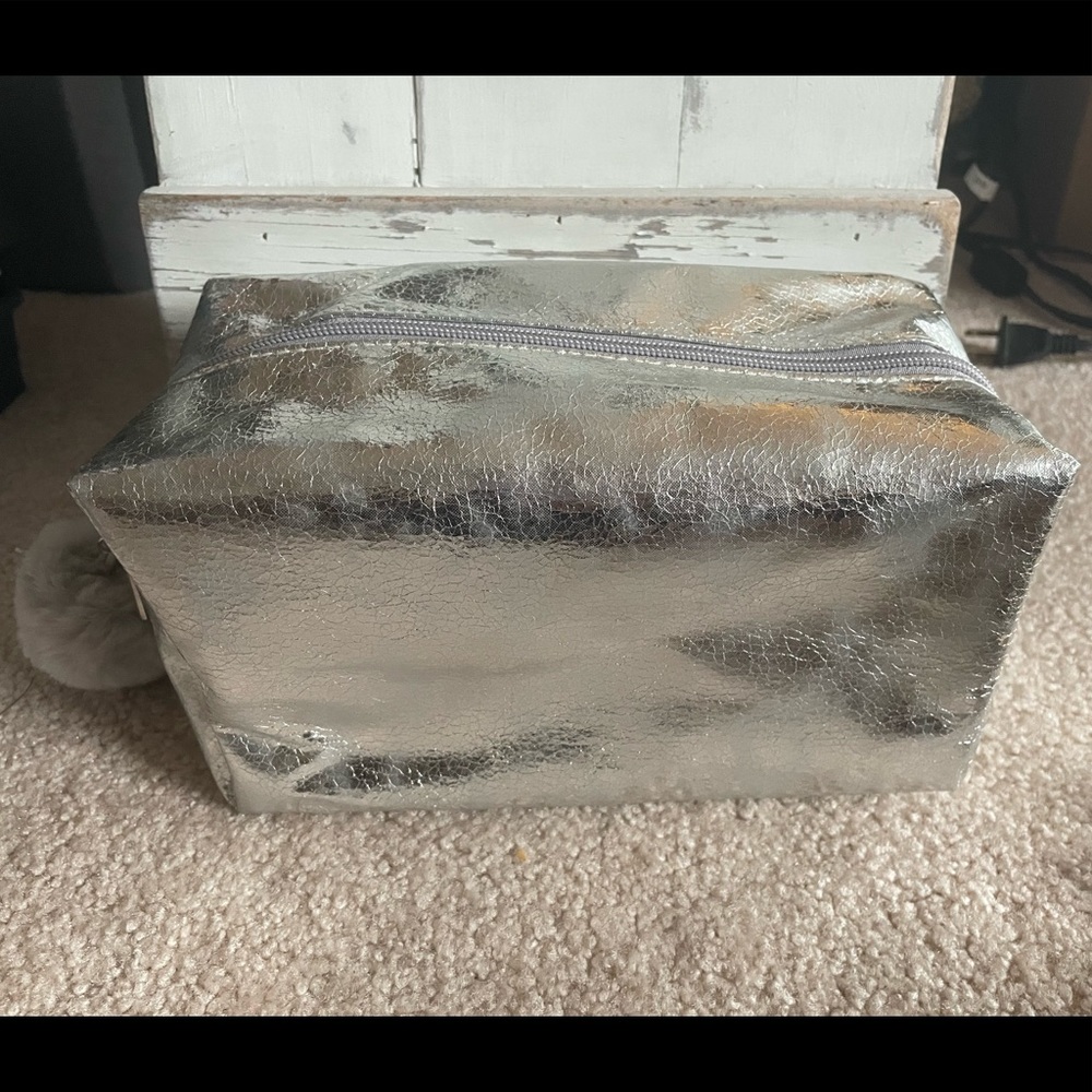 NWOT Silver Metallic Large Cosmetic Bag with Pom Zipper
